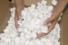 Closeup-of-female-hands-holding-heap-of-packing-peanuts-in-cardboard.jpg